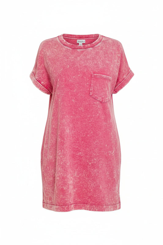 Woman wearing a pink t-shirt dress on a white background