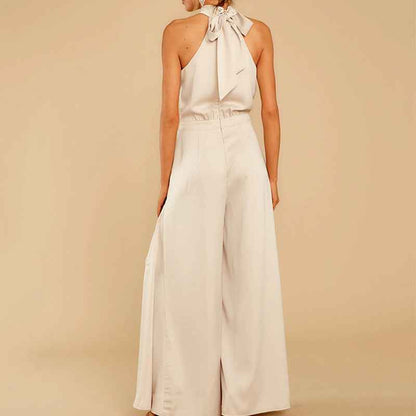 one-piece jumpsuit blends modern minimalism with retro flair, featuring an off-the-shoulder neckline