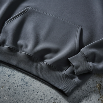 Close-up of ribbed cuff and kangaroo pocket on charcoal heavyweight hoodie