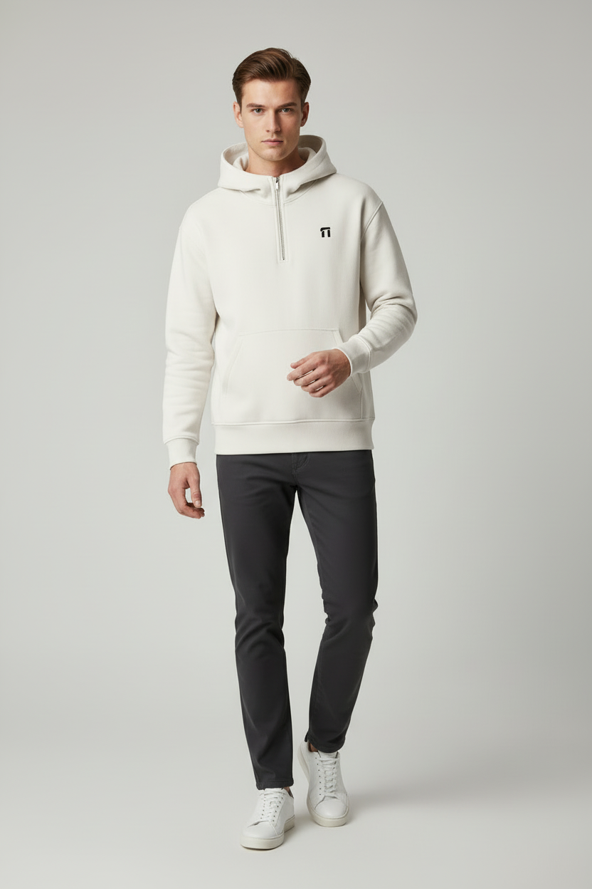 Same model in dynamic pose wearing white Stonehenge hoodie